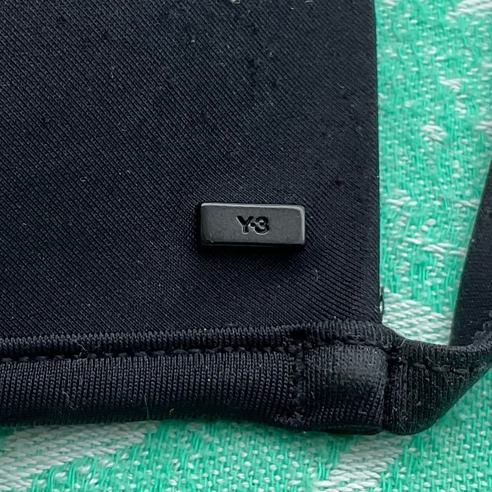 Y-3 Sleek Black Swimwear Top. Also great under transparent shirts.